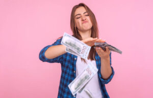 Woman with a stack of money that she saved