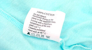 close up of a clothing care tag with laundry instructions