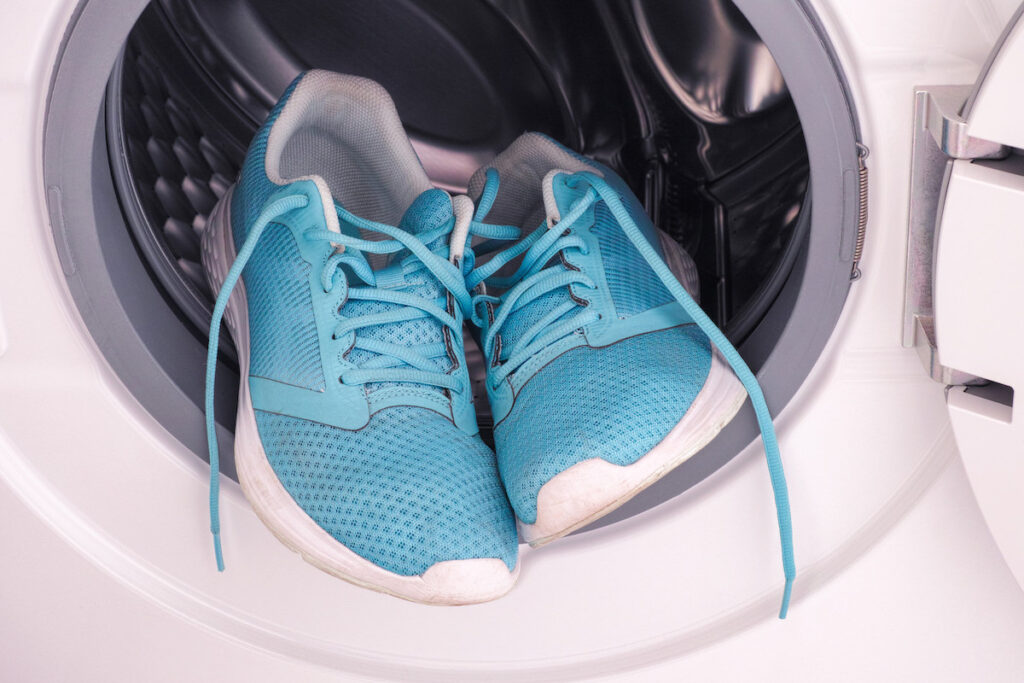 Blue athletic shoes in washing machine