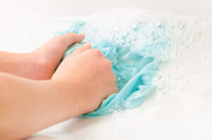 Woman Hand washing an article of clothing