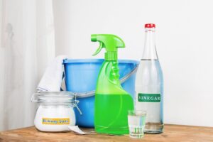 Variety of eco-friendly cleaning products on a wood countertop